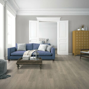 Living room laminate flooring with blue sofa | Carpet Exchange